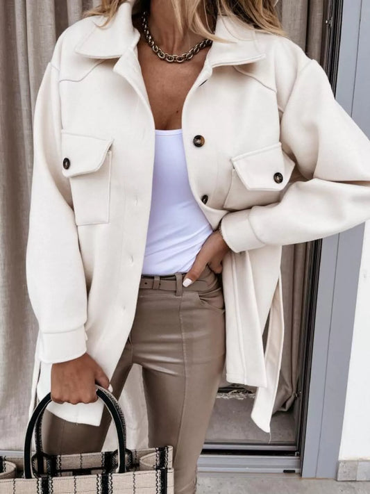 Women’s white button-down coat with tie waist and pockets