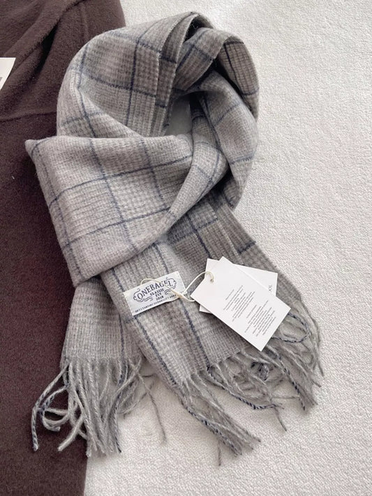 Plaid wool scarf with fringe trim for cold-weather layering