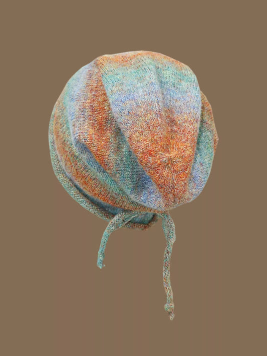 Colorful wool knit beanie in light blue tie-dye pattern