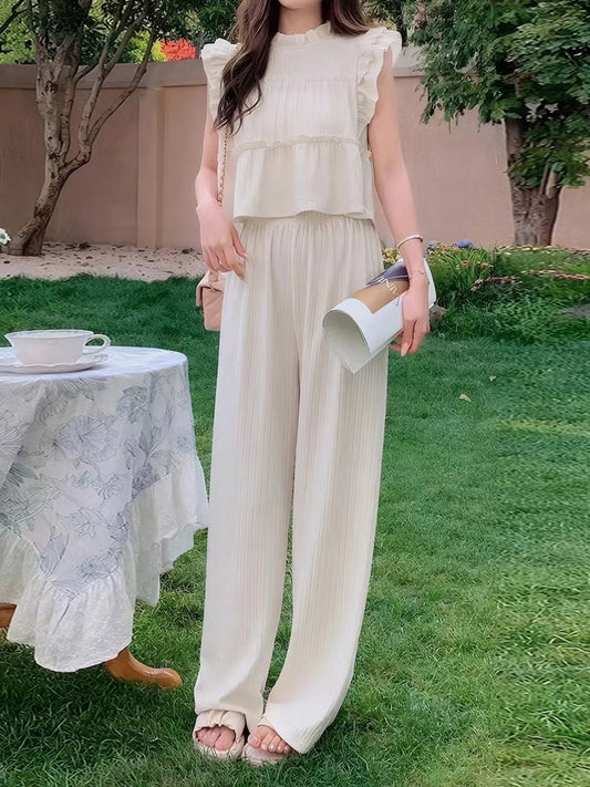 Women’s sleeveless ruffled top and wide-leg pants resort outfit