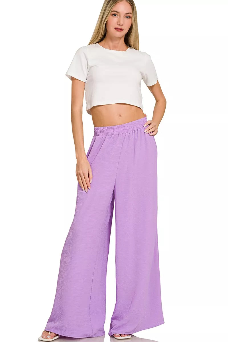 Lavender wide-leg pants detail on women’s two-piece resort outfit