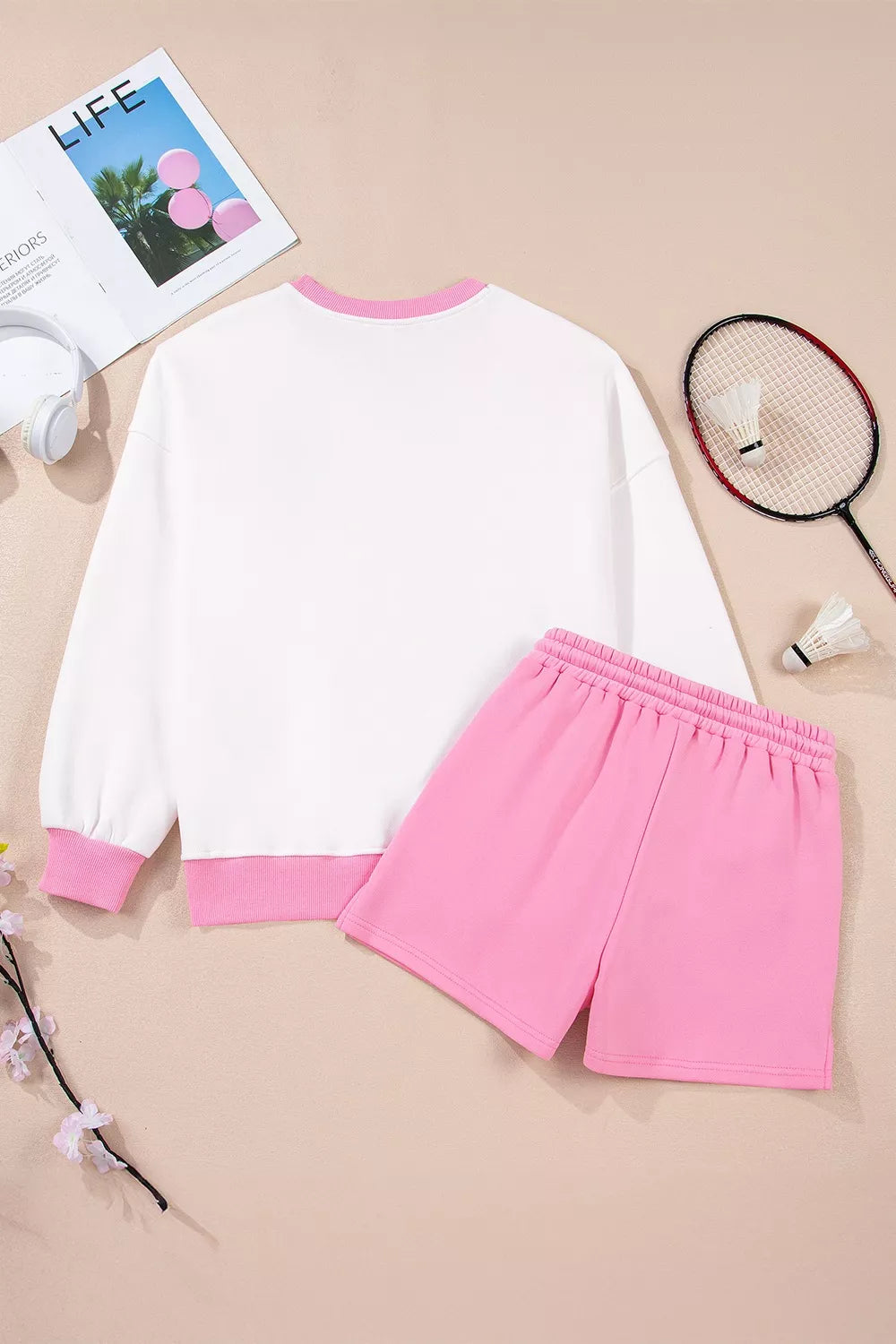 Color-block sweatshirt and shorts set styled for resort casual wear