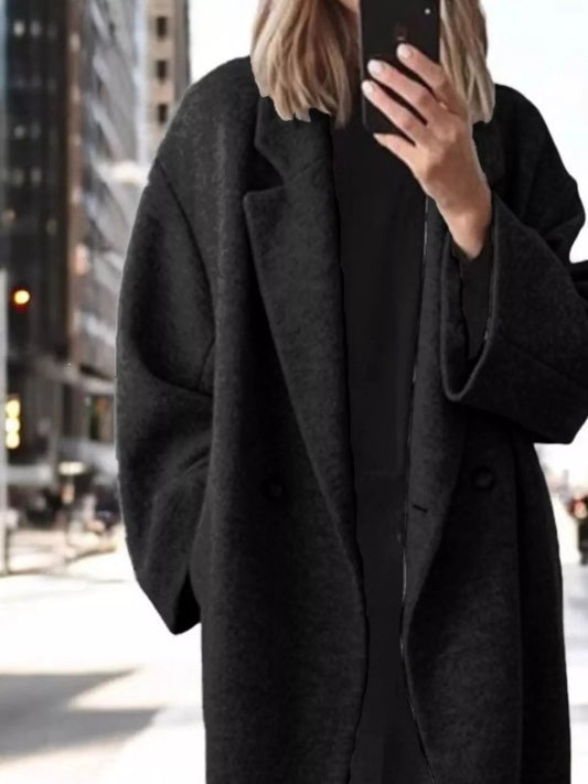 Women’s black longline coat with lapel collar and buttoned front