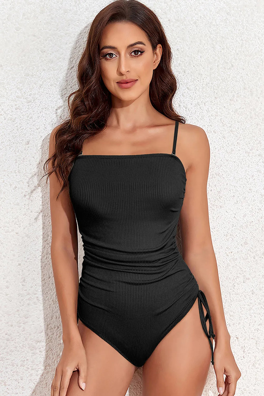 Black spaghetti strap one-piece swimsuit for resort vacations