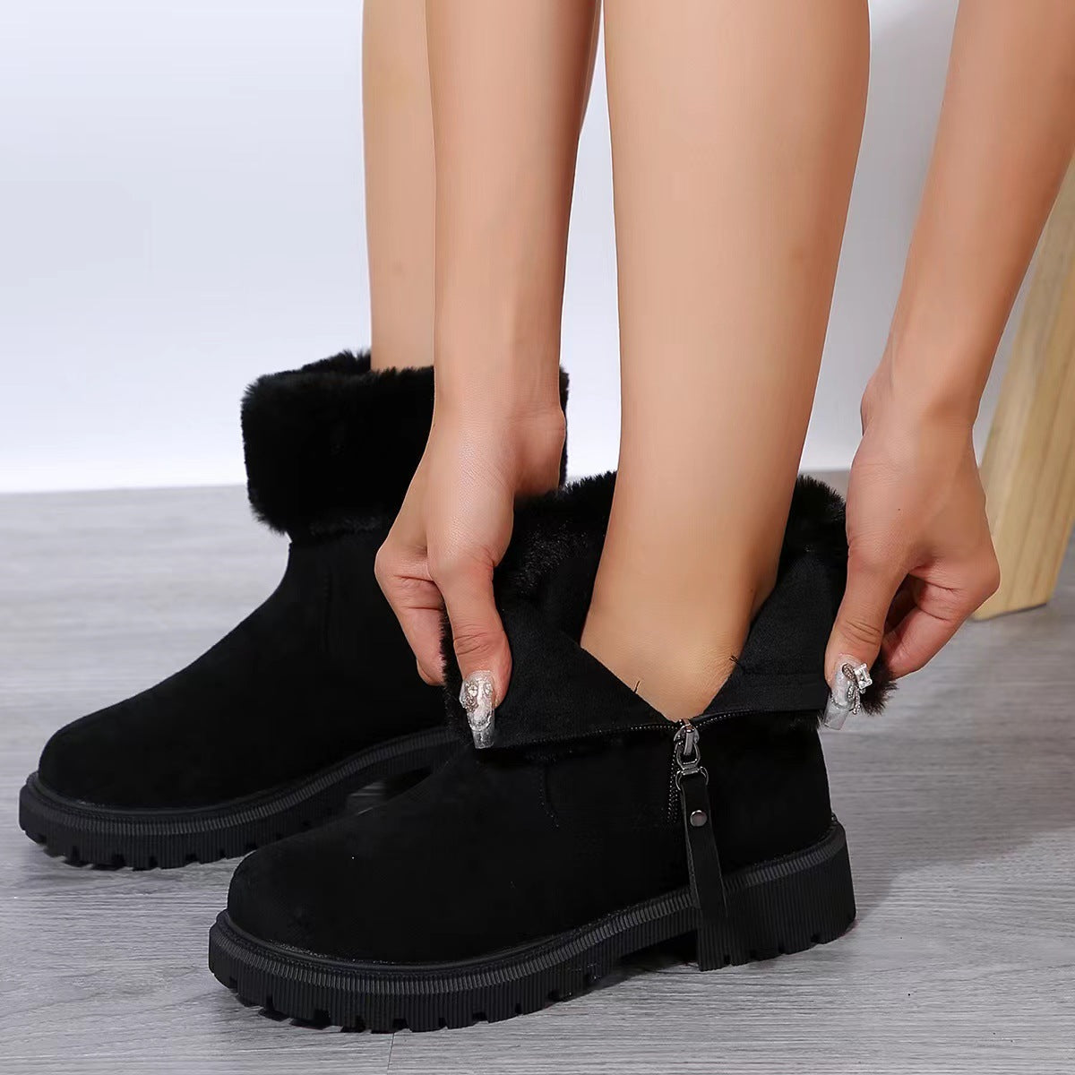 Rubber sole and thick heel detail on Aspen plush-lined winter boots