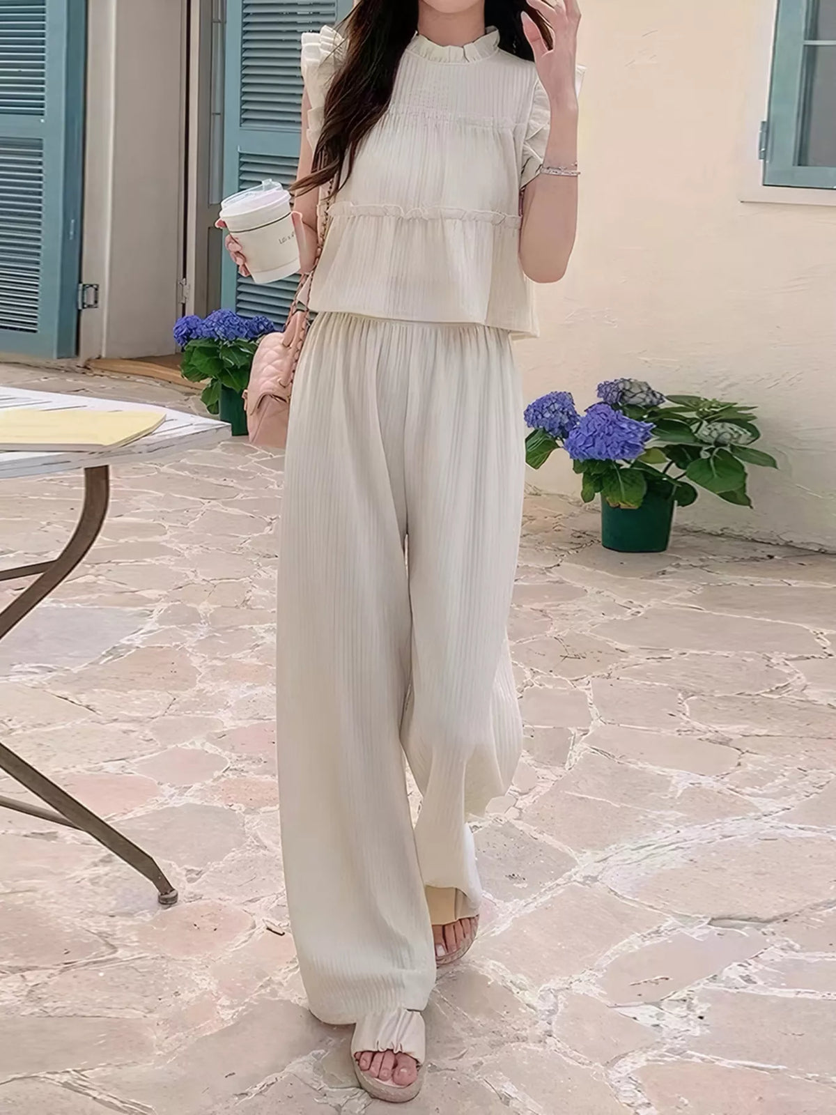 Apricot two-piece pants set styled for cruises and vacation dinners
