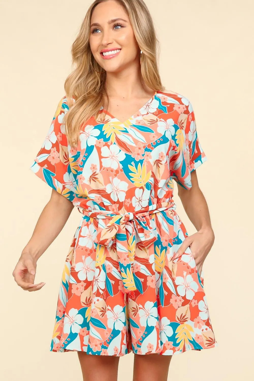 Coral teal and light blue floral romper for vacation style