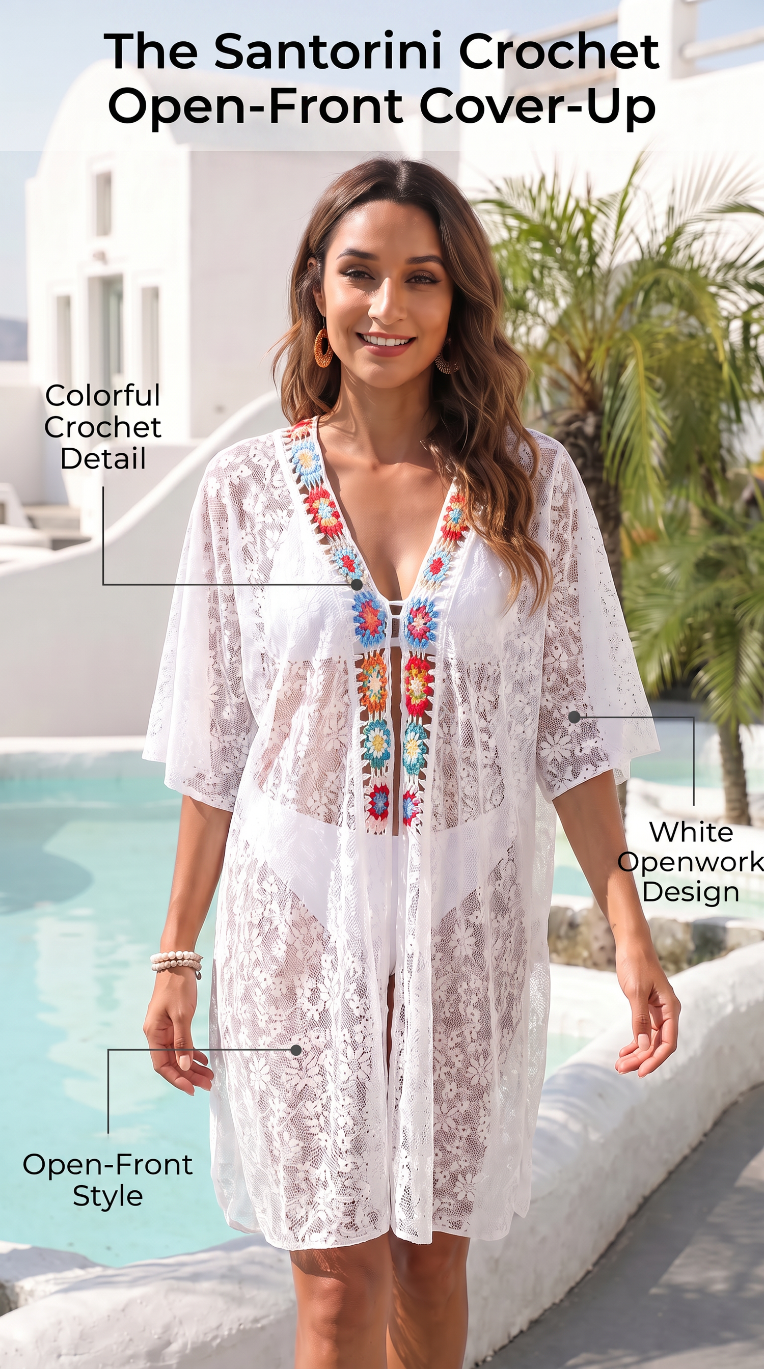 White crochet open-front cover-up dress with colorful embroidered detailing at the neckline.