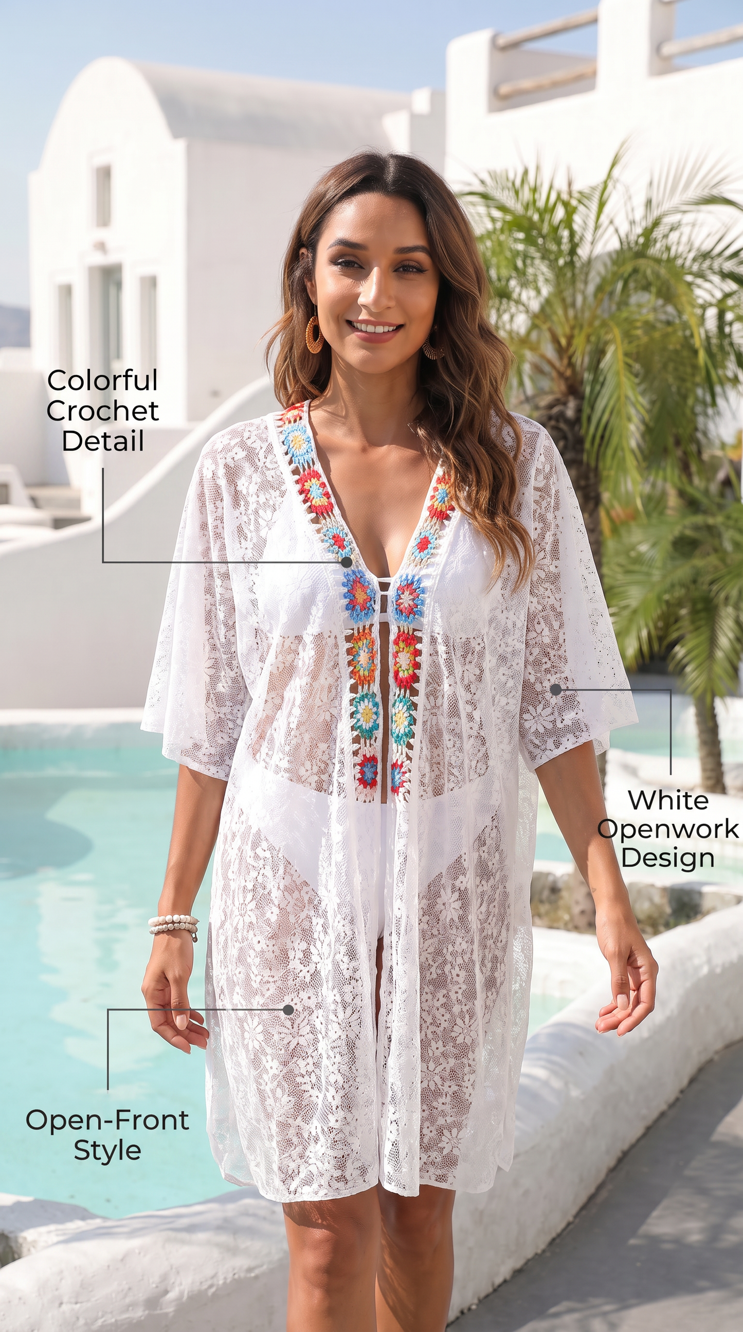 White crochet lace cover-up dress with colorful embroidered detailing at the neckline.