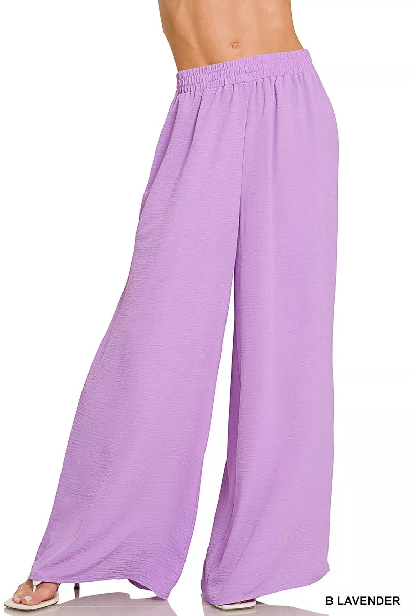 Lavender wide-leg pants detail on women’s two-piece resort outfit