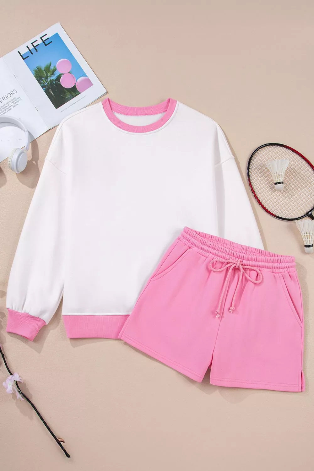 Color-block sweatshirt and shorts set styled for resort casual wear